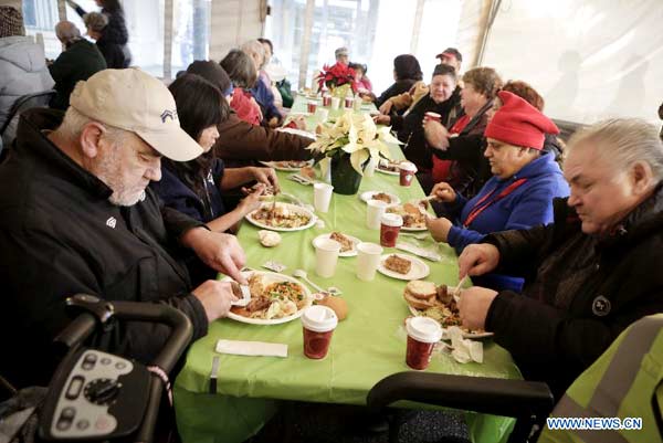 People enjoy free meal at 'Table for 2000' event