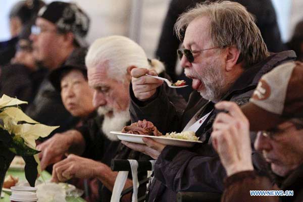 People enjoy free meal at 'Table for 2000' event