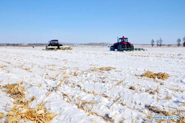 Heilongjiang's farmers begin spring ploughing in snow