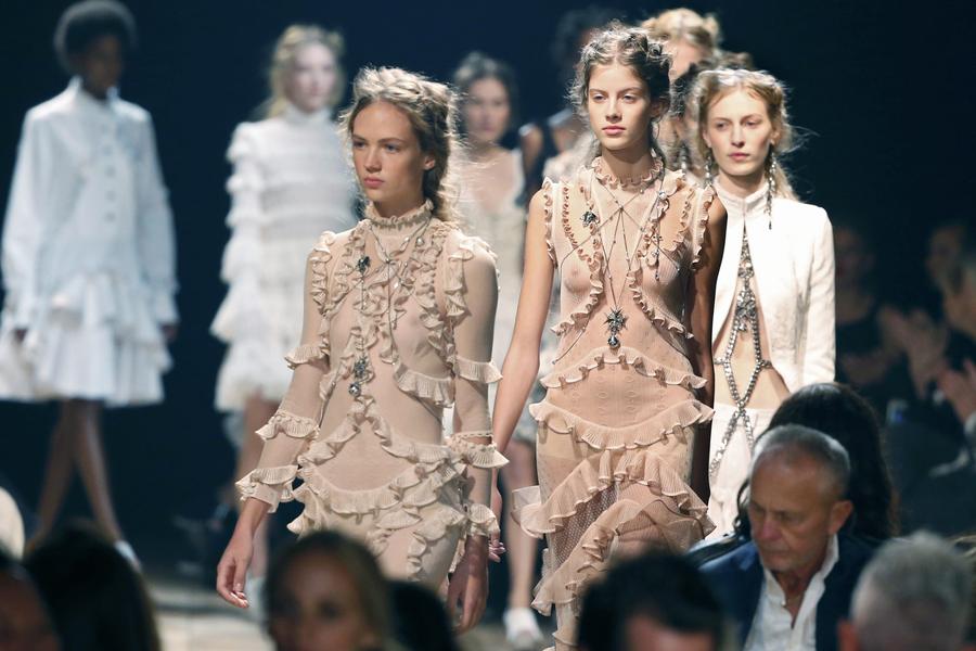 Models present creations during Paris Fashion Week