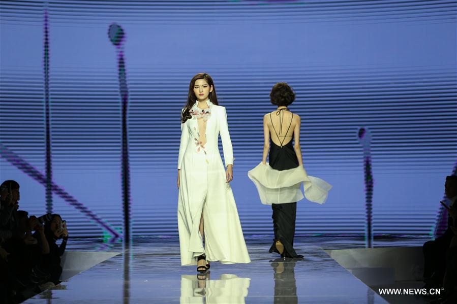 Models display Grace Chen's creations in Beijing