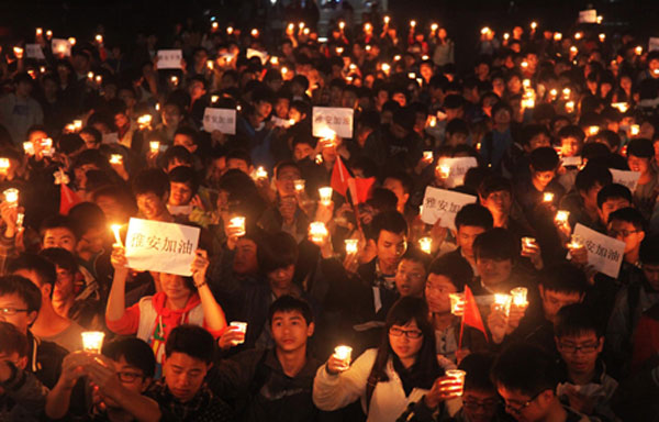 Candlelight prayers for quake victims