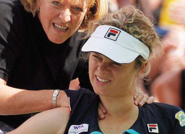 Wozniacki through, Clijsters out injured at Indian Wells