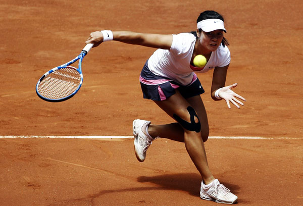 Li Na fights back for last eight at Madrid open