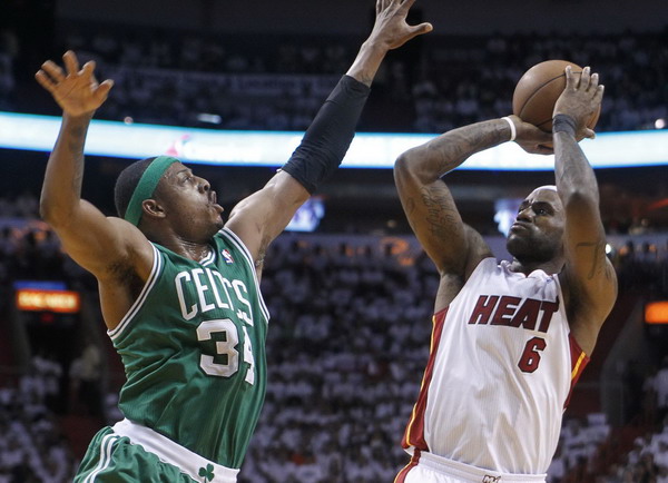 James delivers decisive blow as Heat finish Celtics