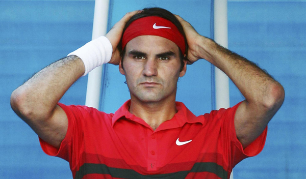 Federer marks 1000th match with victory