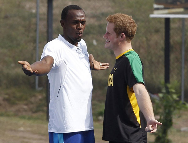 Prince Harry runs with Usain Bolt in Jamaica