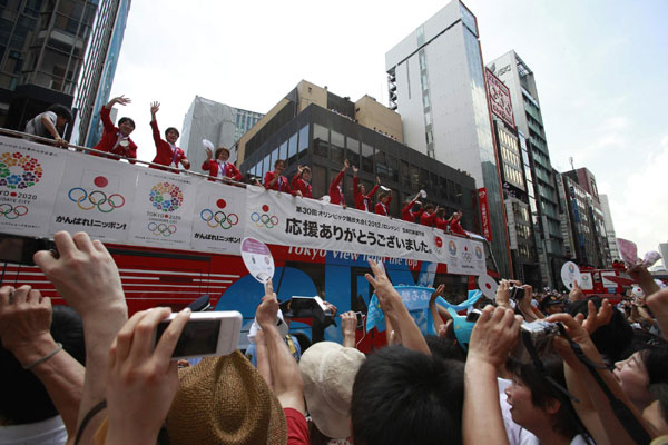 First Olympic parade brings Tokyo to standstill
