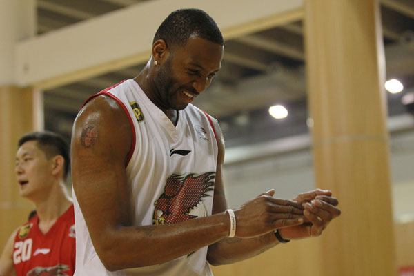 McGrady débuts training with new team