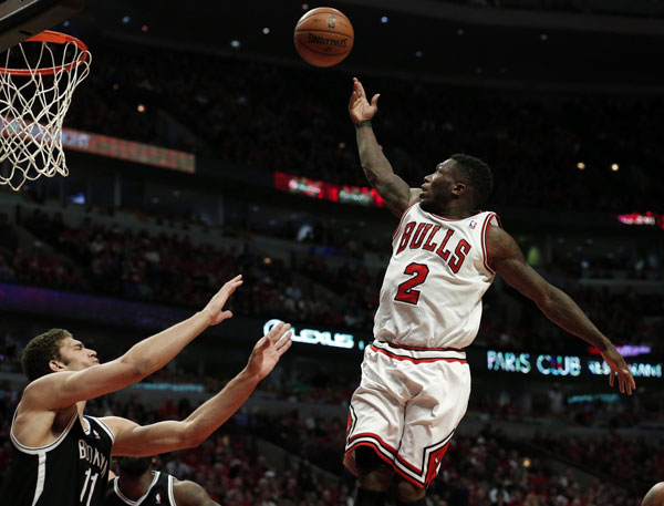 Robinson sparks Bulls to 3OT win over Nets