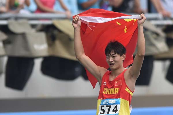 Xu wins 400m hurdles crown in cliff-hanger finish