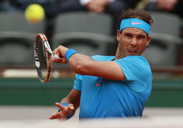 Nadal, Djokovic sail on, Bouchard ousted at Roland Garros