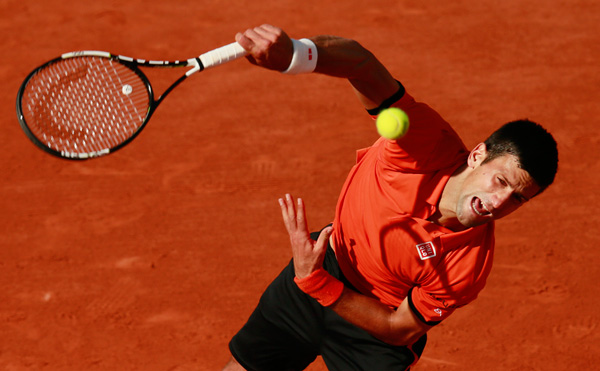 Inspired Wawrinka tames Djokovic to win French Open