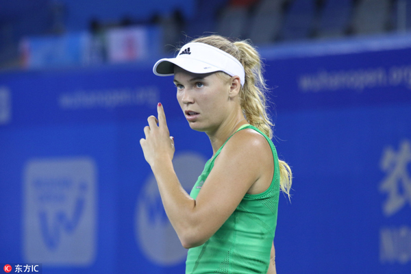 Wozniacki down Stosur to win sixth straight at Wuhan Open