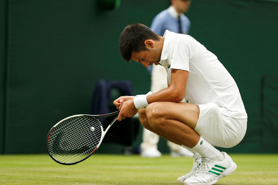 Djokovic hits out over delay after booking place in quarters