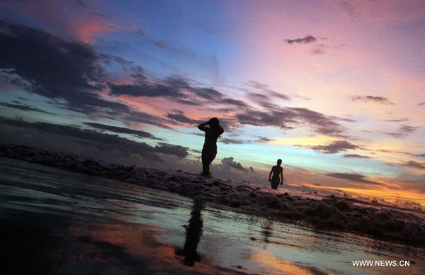 Tourists enjoy time on Tamarindo Beach in Costa Rica