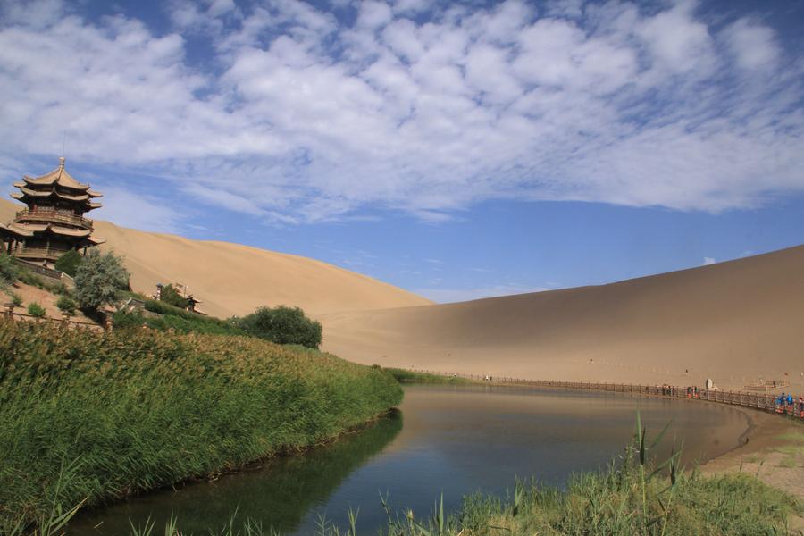 Tourists visit Mingsha Mountain in Dunhuang, NW China