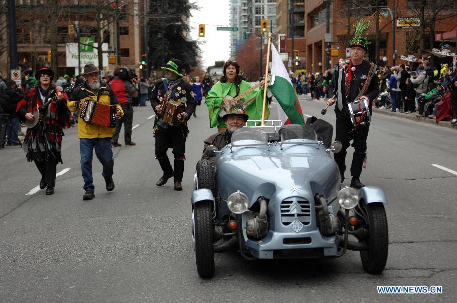 People take part in St. Patrick's Day Parade in Vancouver
