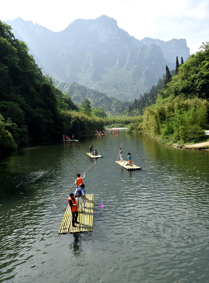 Tourists enjoy bamboo rafting in China's Hubei