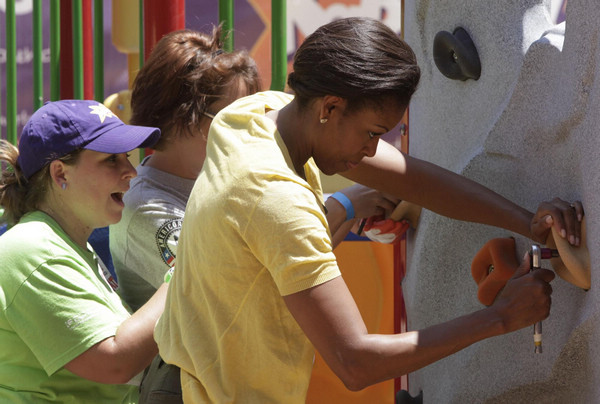 US first lady joins volunteers to build playground