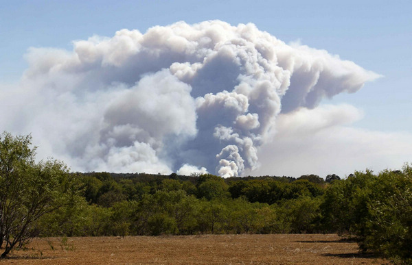 2 dead in Texas wildfires, homes destroyed