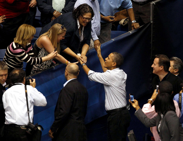 Obama, Cameron watch basketball tournament