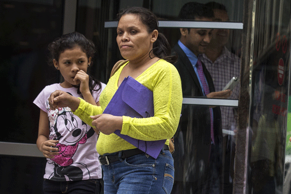 First US flight deports Honduran kids under fast-track drive