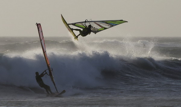 Windsurfers taking on waves in Cape Town