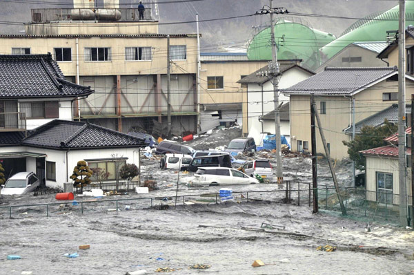 NE Japan coast ravaged by flood, fires after quake