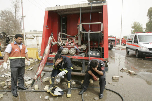 Twin bombs kill 27 at police station in Iraq