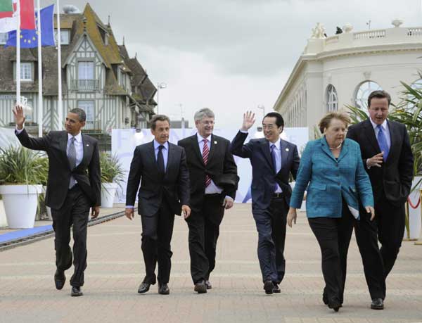 G8 says world economy strengthening, eyes debt