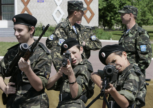 Ukrainian teenagers armed at military base