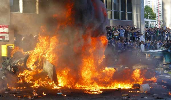 Cars set on fire in Vancouver following loss