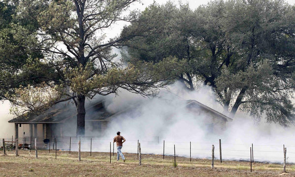 2 dead in Texas wildfires, homes destroyed