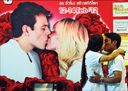 Couples face off in kissing contest