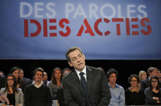 Sarkozy says to trim migrants quota by 50%