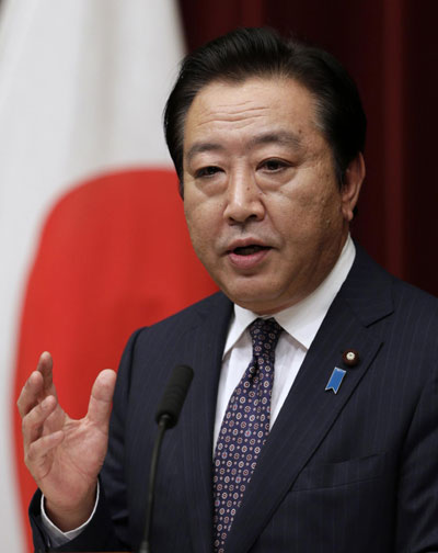Japan passes controversial tax bills