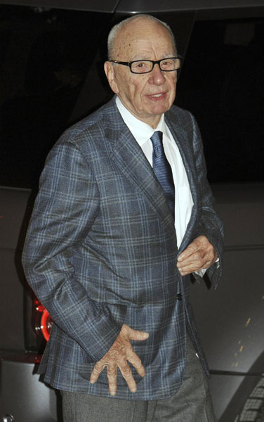 Rupert Murdoch quits boards of British papers