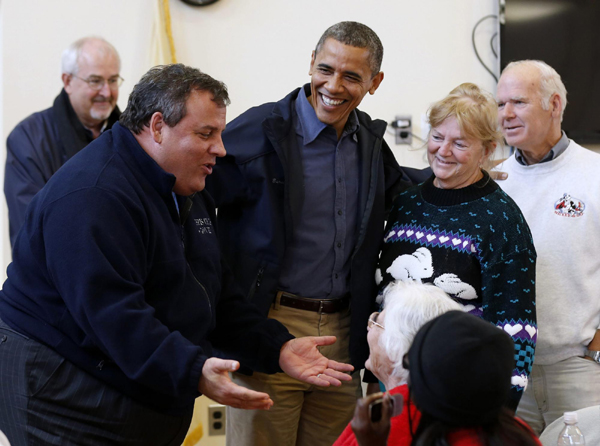 Obama front and center in storm crisis as Romney subdued