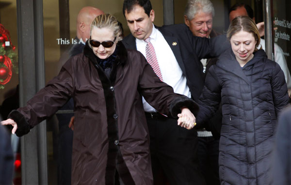 Clinton back home after treatment
