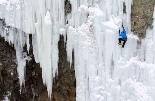 Climber on Swiss ice wall