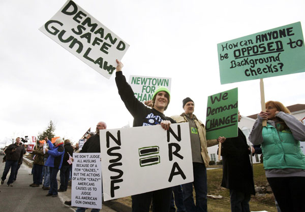 Brady Eggleston of Newtown participates in a protest outside the National Shooting Sports Foundation in Newtown, Connecticut, March 28, 2013. Newtown school gunman fired 154 rounds in less than 5 minutes
