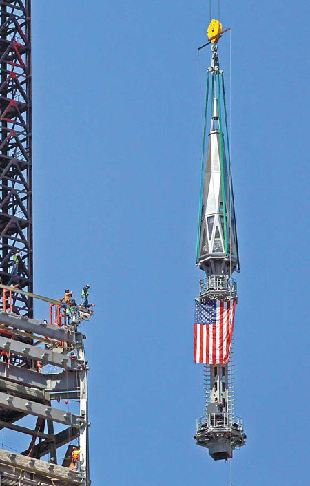Spire hoisted to top of One WTC