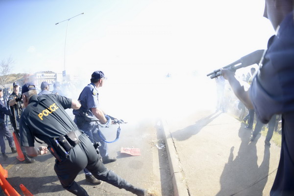 Police fire stun grenades at protesters against Obama