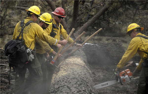 Firefighters hold line against California wildfire
