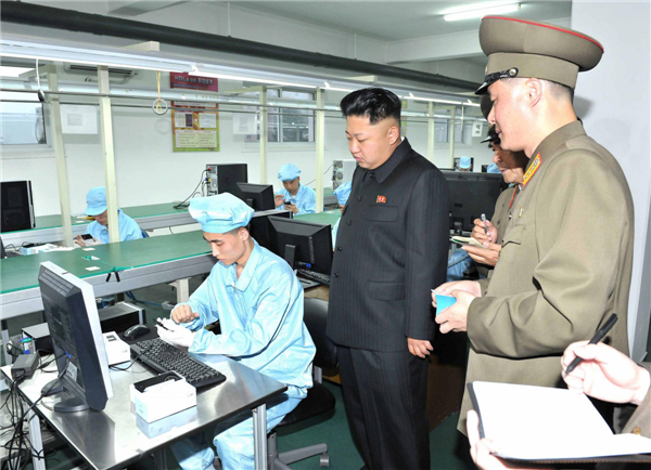 Kim Jong-un visits mobile phone factory