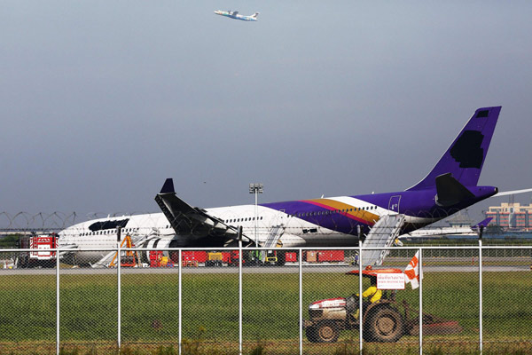 Plane skids off Bangkok runway, 13 injured