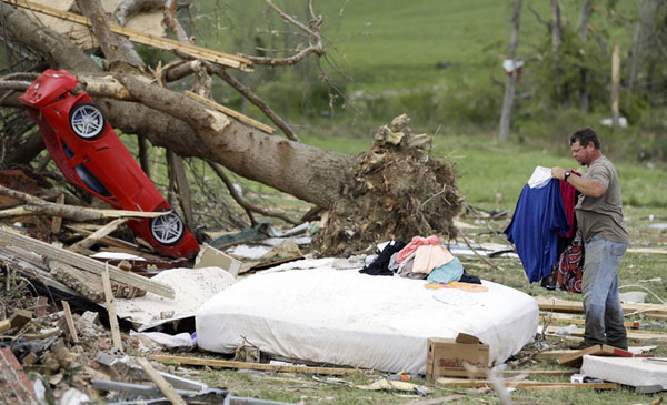 Death toll rises as storms tear through south US