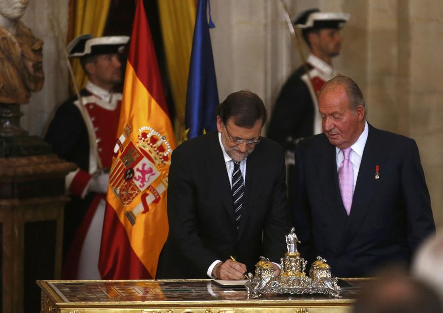 King Juan Carlos I of Spain signs abdication bill