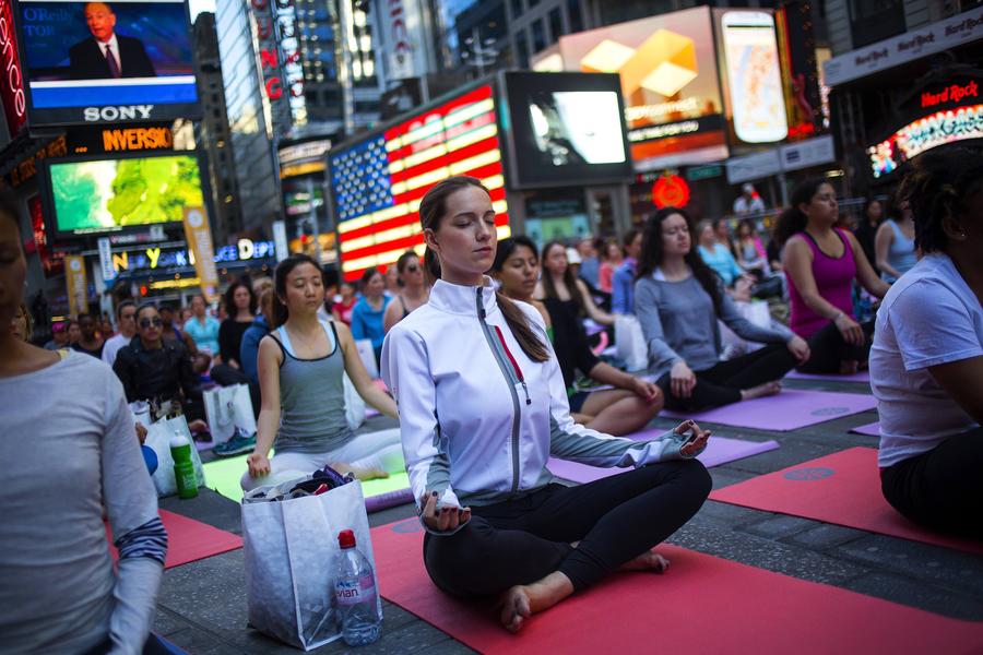 Thousands celebrate Summer Solstice with yoga in NY